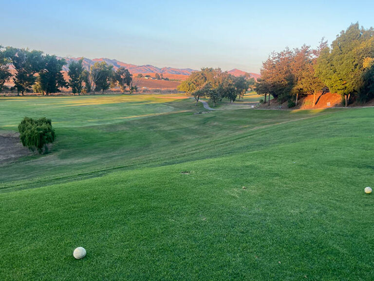Tee box overlooking a wide fairway and rolling hills at Ridgemark Golf Club & Resort in Hollister, California.